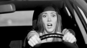 a female driver about to have a car accident