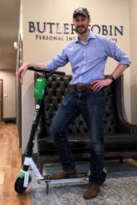 Jeb Butler on a scooter in his Atlanta offices