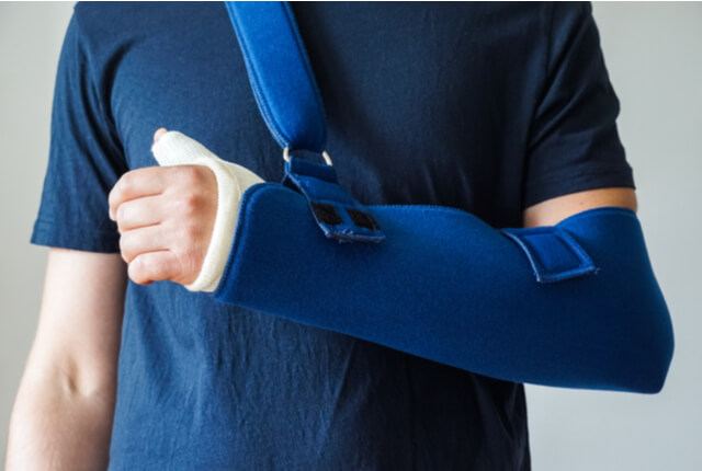 person wearing a sling on their arm after personal injury in Georgia