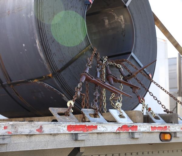 heavy load on a Georgia flatbed trailer chained down well