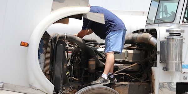 Georgia truck mechanic working on a semi-tractor truck