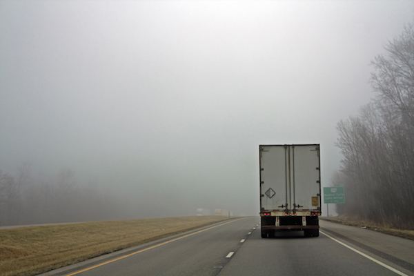 tractor trailer truck on a Georgia highway on a foggy morning
