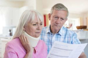 A Georgia husband and wife looking at medical bills after a car accident
