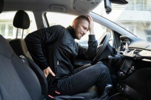 Driver experiencing back pain from car accident.