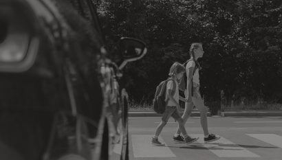 two children crossing a crosswalk in front of an Atlanta pedestrian accident law office