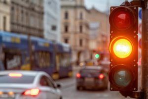 Yellow traffic light in the highway.