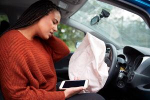Airbags deploy after car accident female motorist feeling neck pain after.