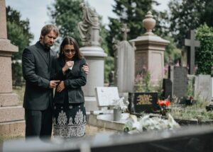 Grieving couple in the cemetery