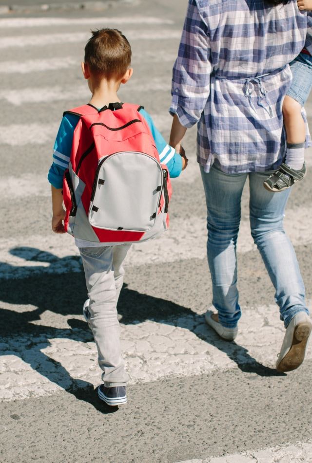 Woman and child crossing the street