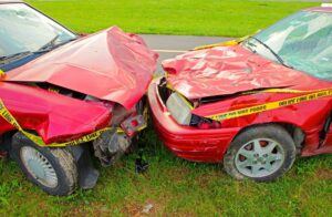 Two red cars in head-on collision